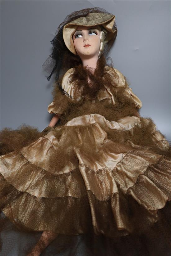 A painted felt and composition fashion doll, 75cm high with silk and taffeta dress